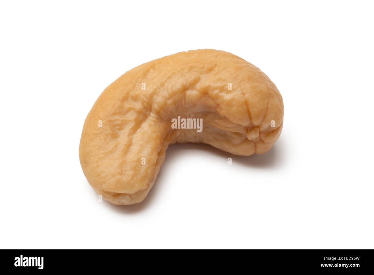 Single cashew nut on white background Stock Photo