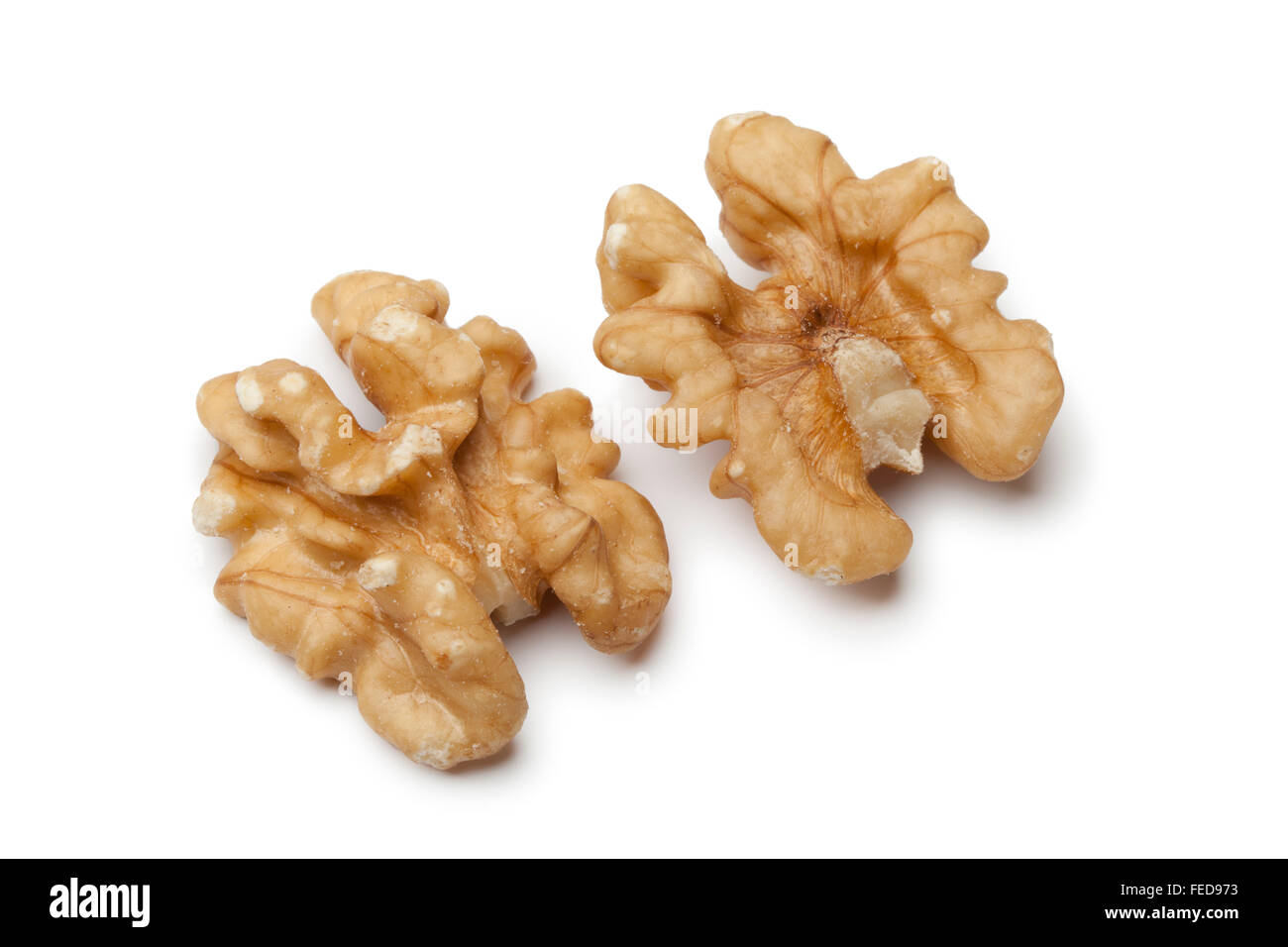 Peeled walnuts on white background Stock Photo