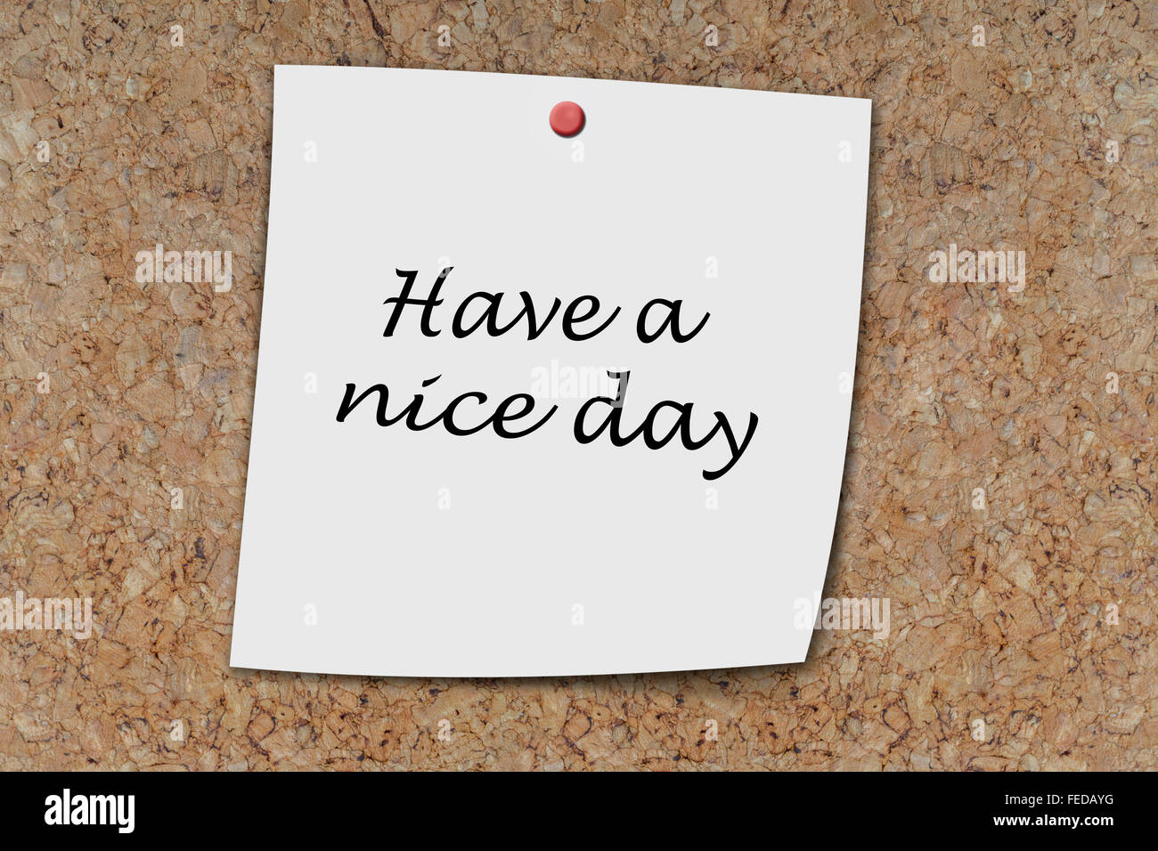 have a nice day written on a memo pinned on a cork board Stock Photo