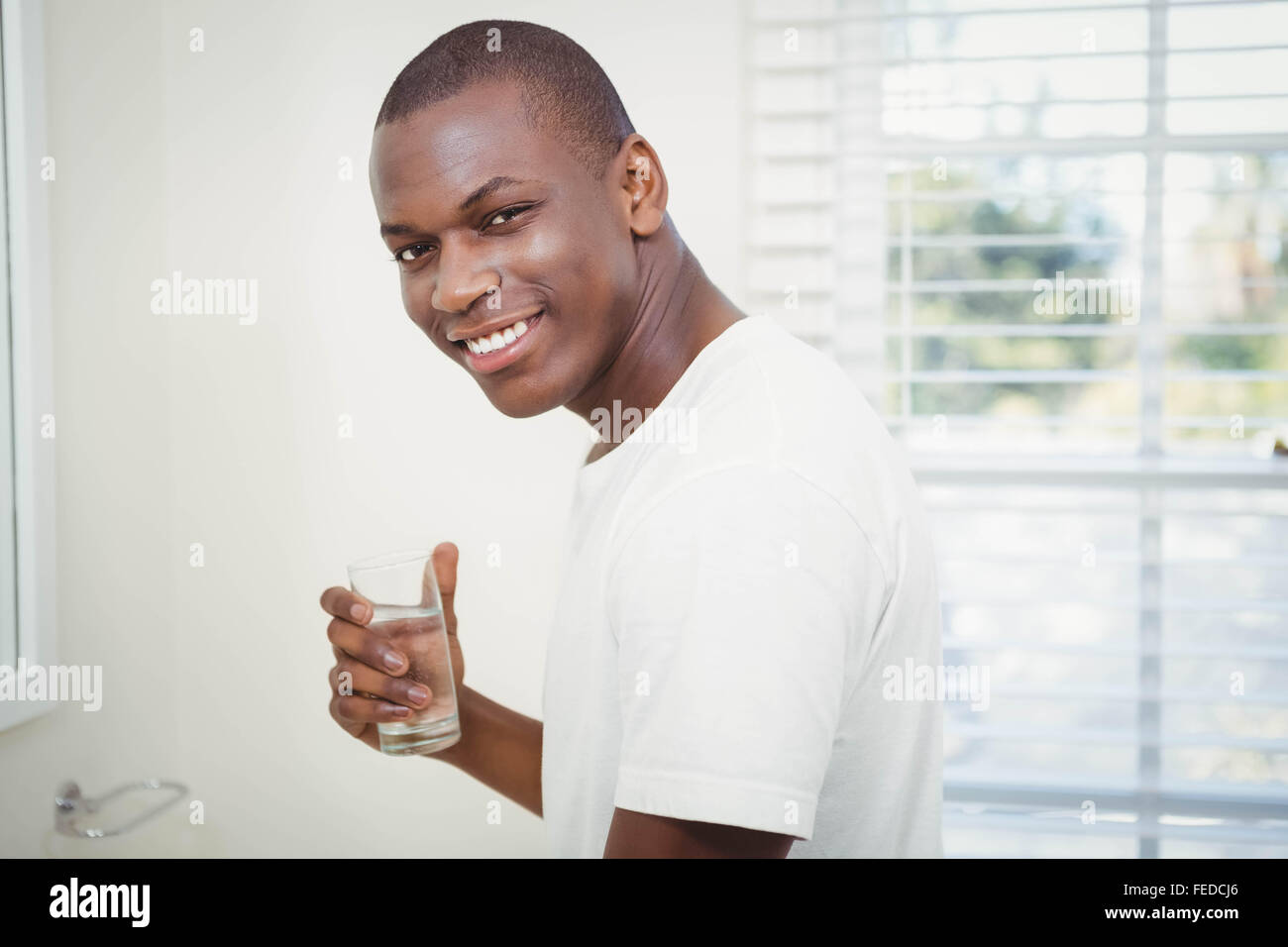 Handsome man drinking water Stock Photo