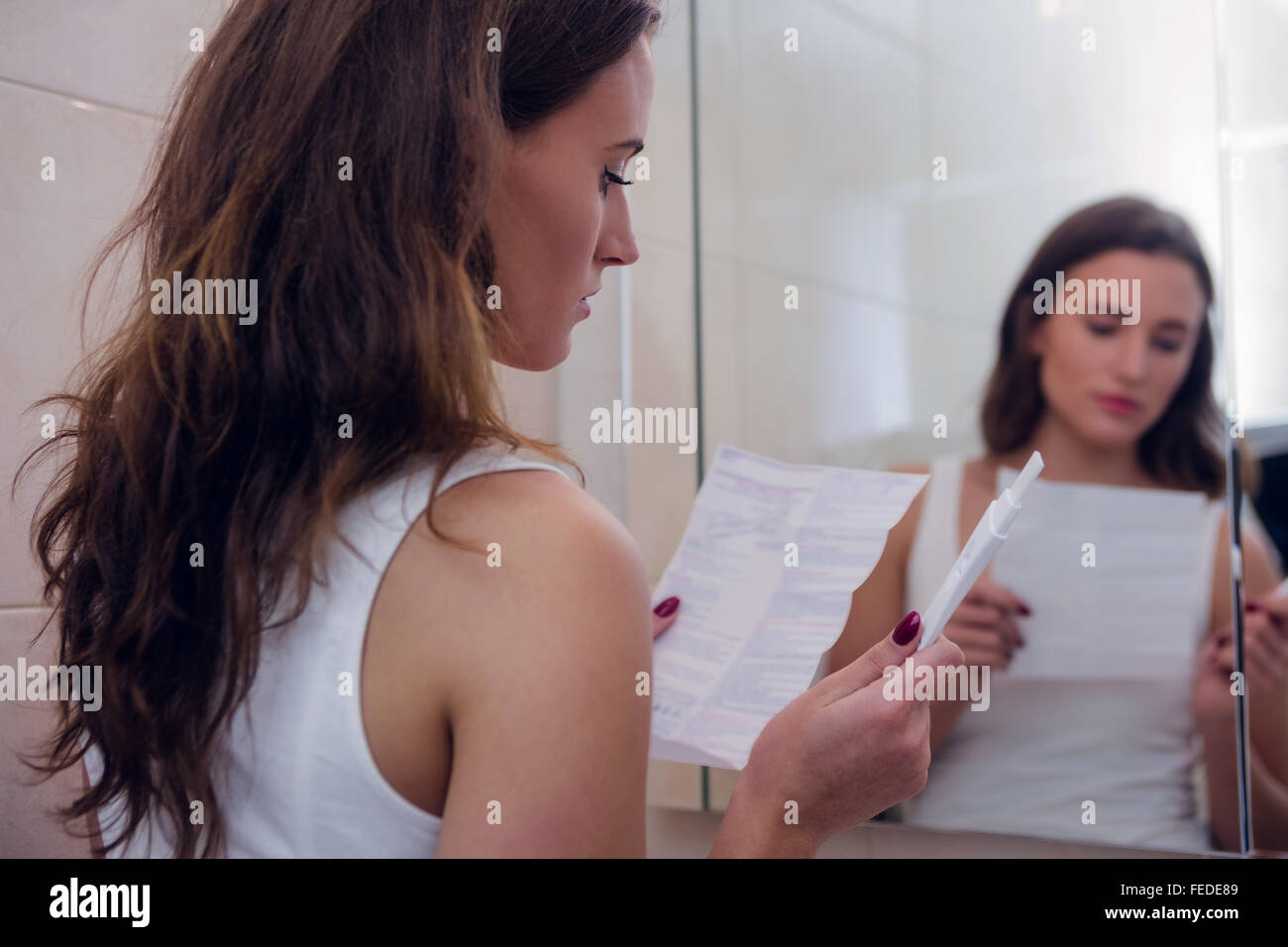 beautiful-brunette-reading-pregnancy-test-instructions-stock-photo-alamy