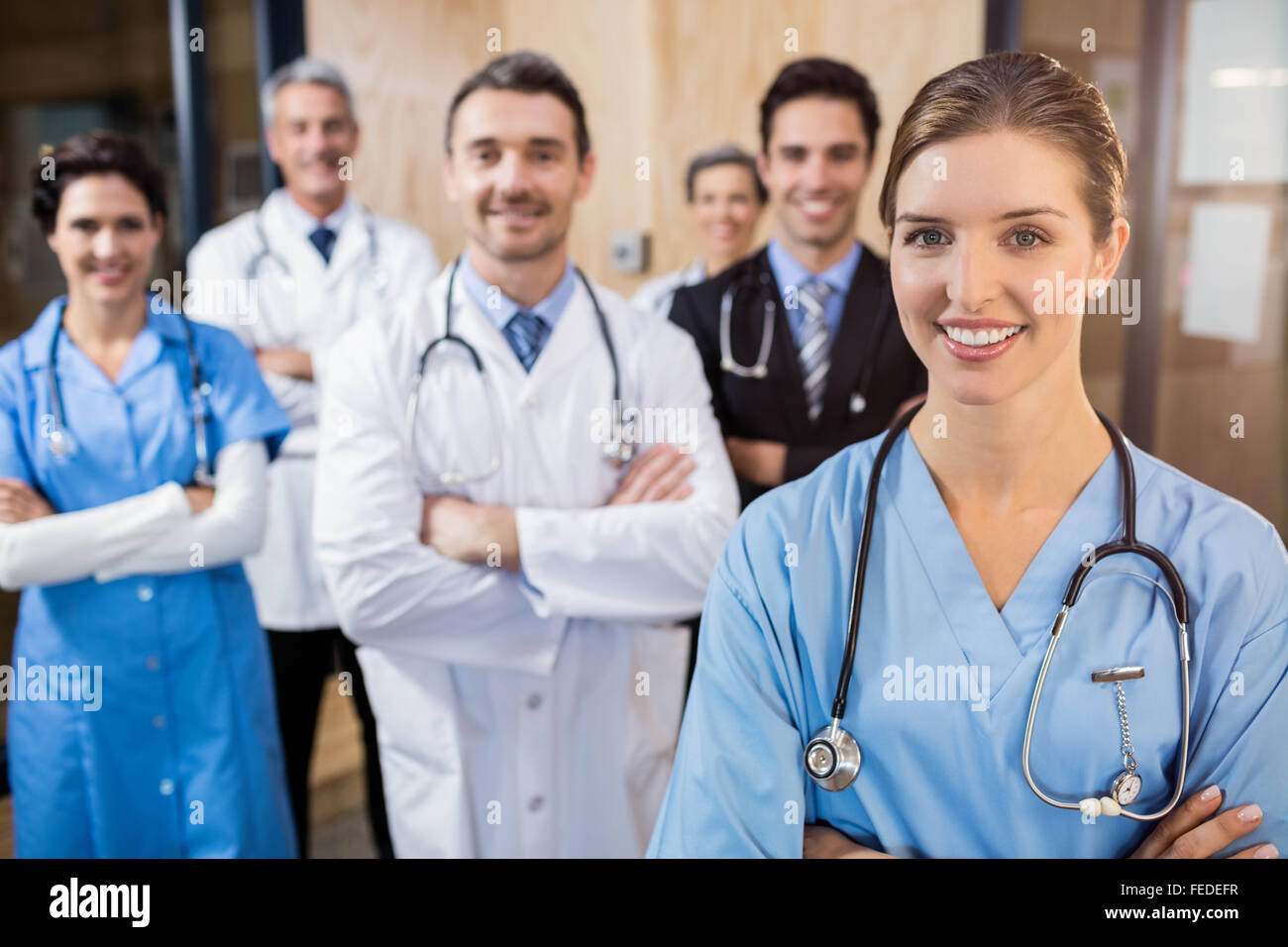 Medical team smiling at camera together Stock Photo - Alamy