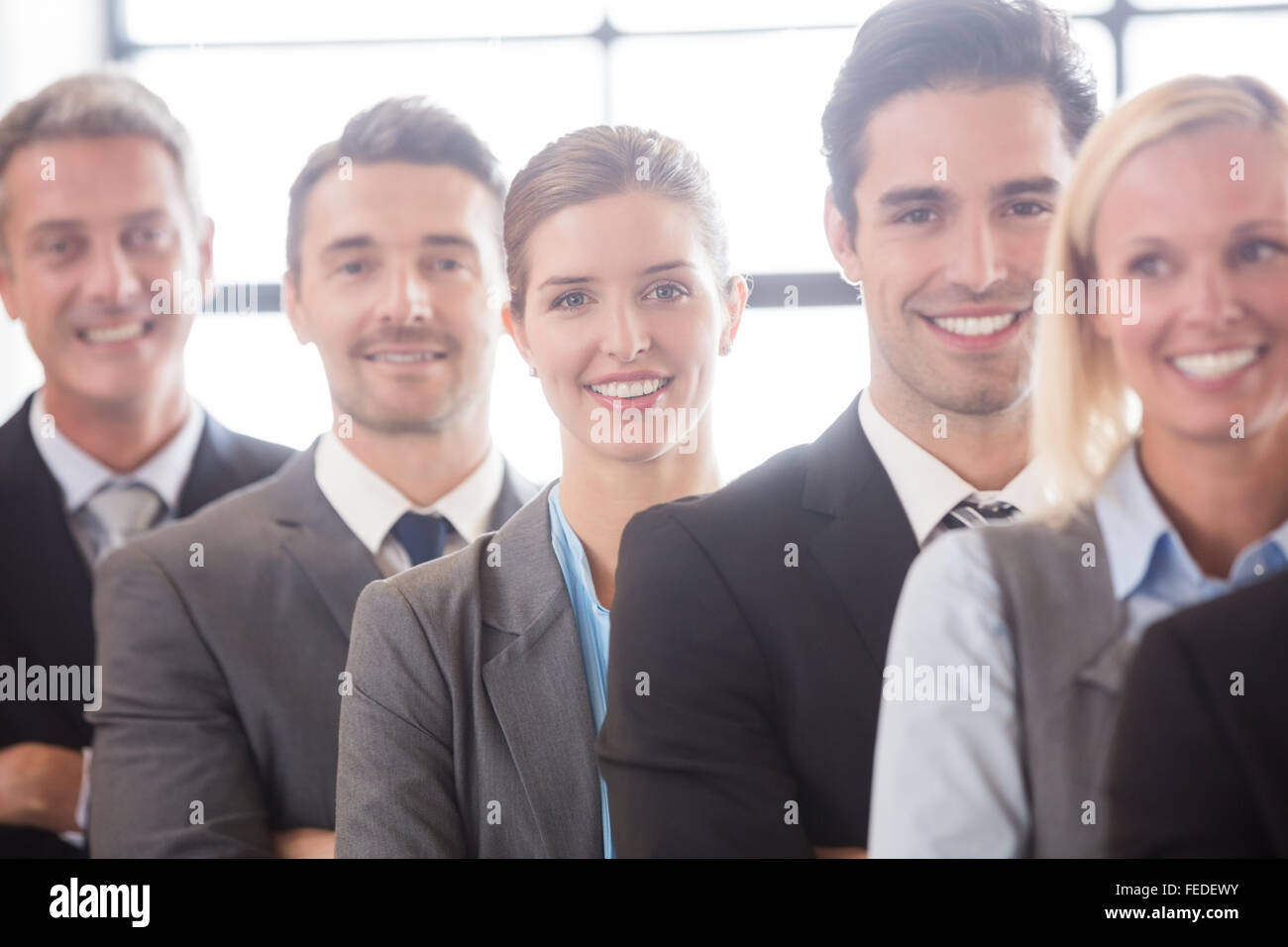 Business team smiling at the camera Stock Photo - Alamy