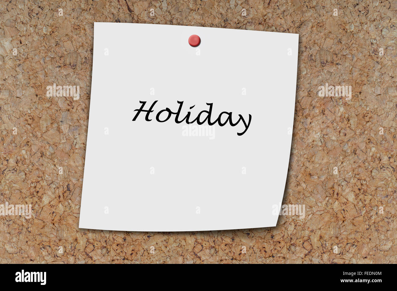 Holiday written on a memo pinned on a cork board Stock Photo