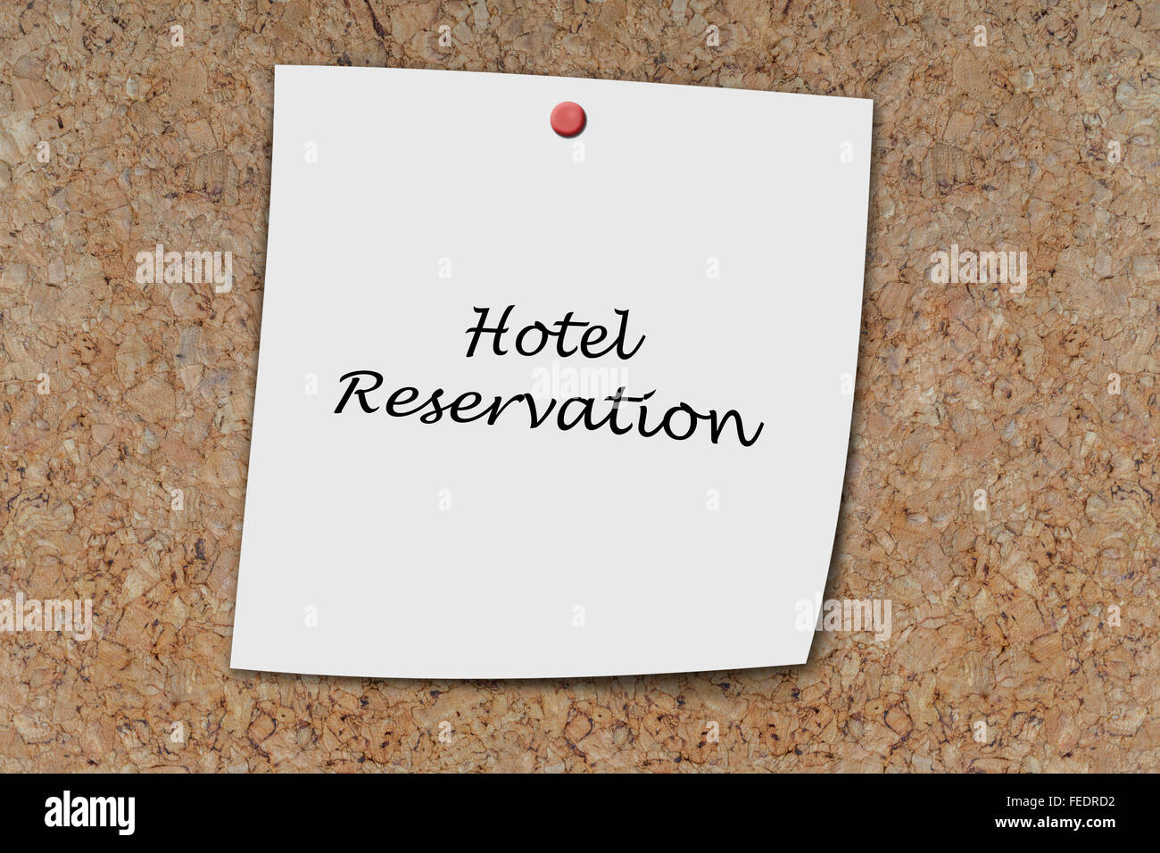 make a hotel reservation written on a memo pinned on a cork board Stock Photo