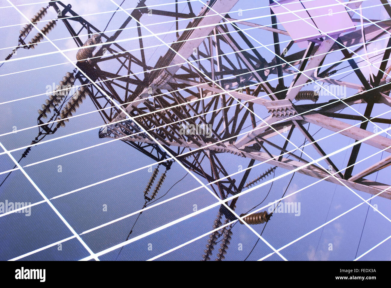 transmission tower reflected in solar panel Stock Photo