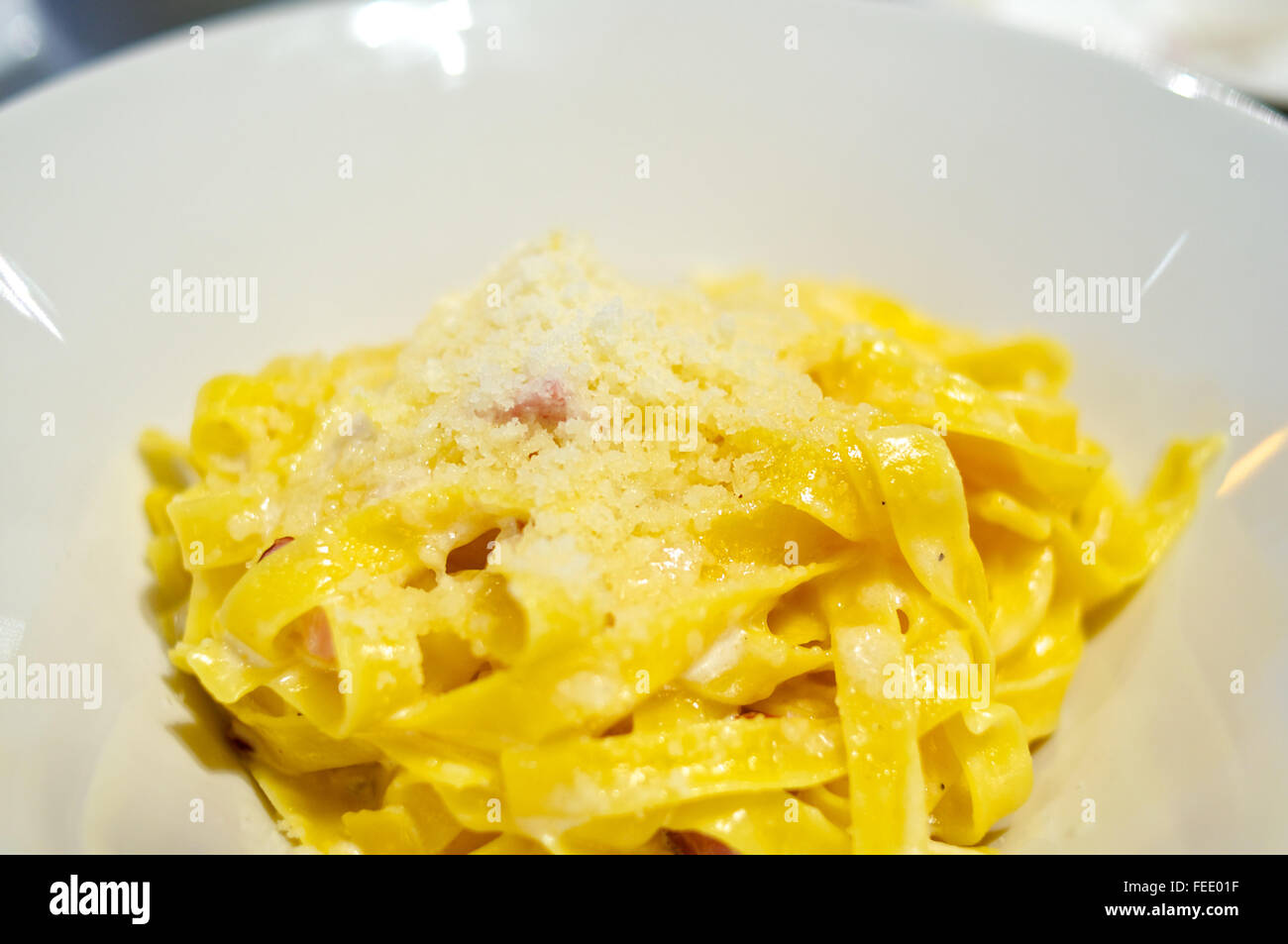 Pasta carbonara with bacon and parmesan in gray plates on the table,  restaurant serve. Traditional Italian cuisine. Home family dinner.View from  above Stock Photo - Alamy