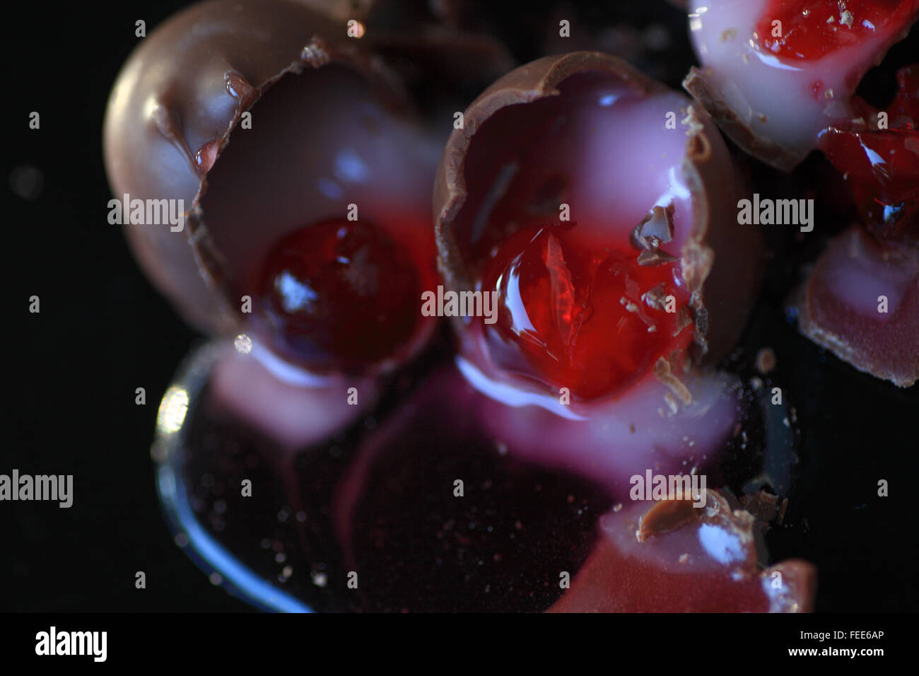 Chocolatecovered cherries opened and in a pool of their own syrup