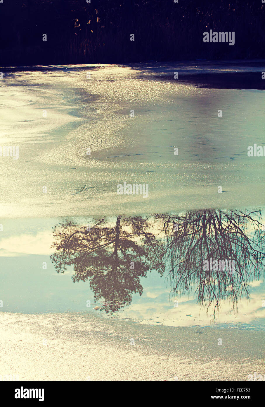 Natural background, back light of frozen lake surface with ice melting ...