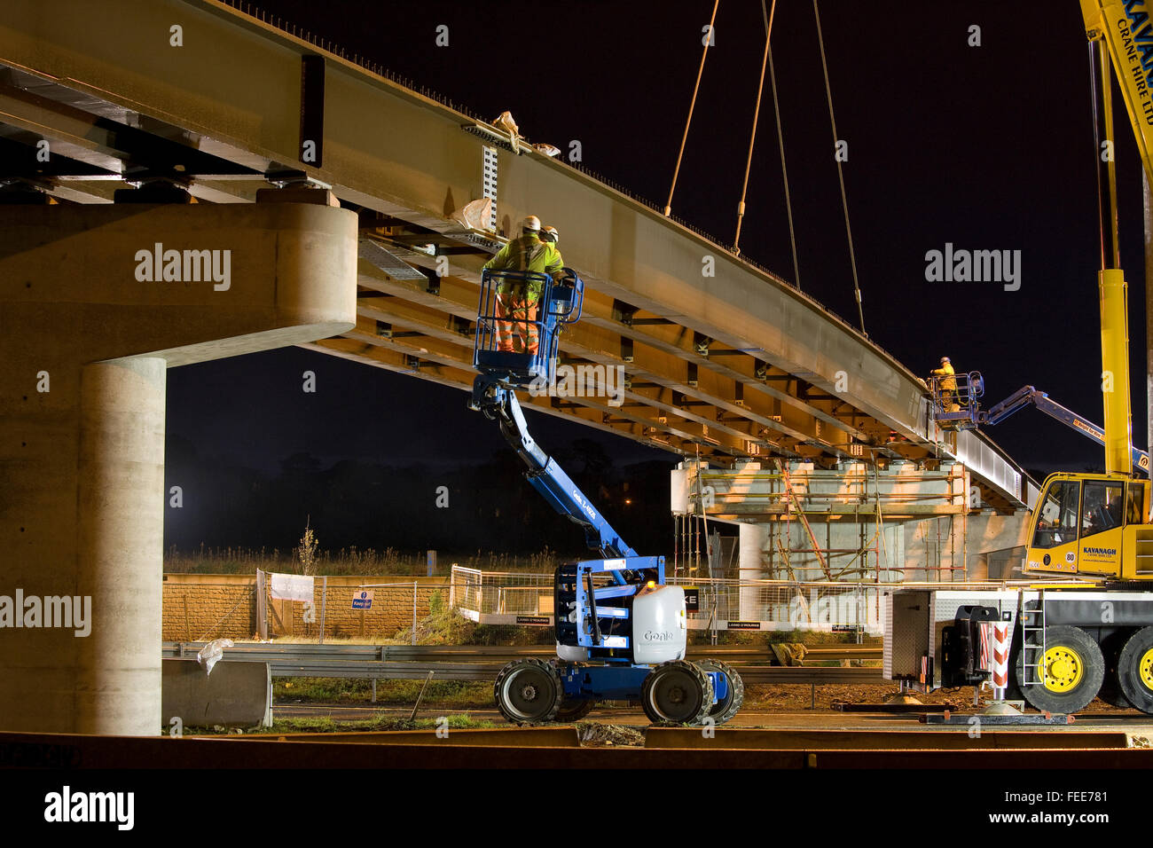 workers bridge construction building cherry picker Stock Photo