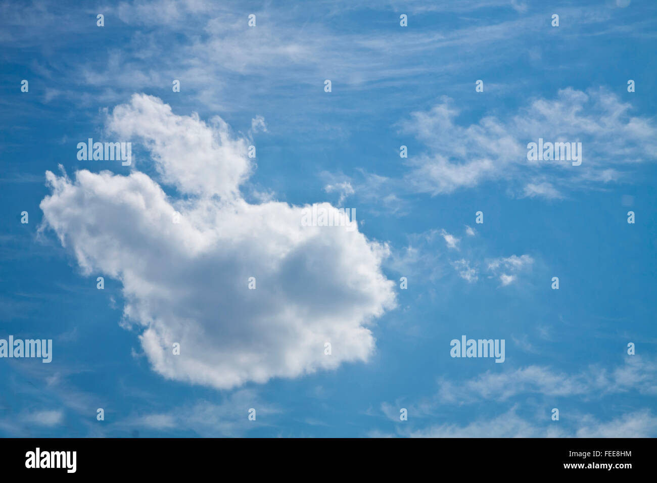 Nature background, white fluffy cloud on blue sky Stock Photo - Alamy