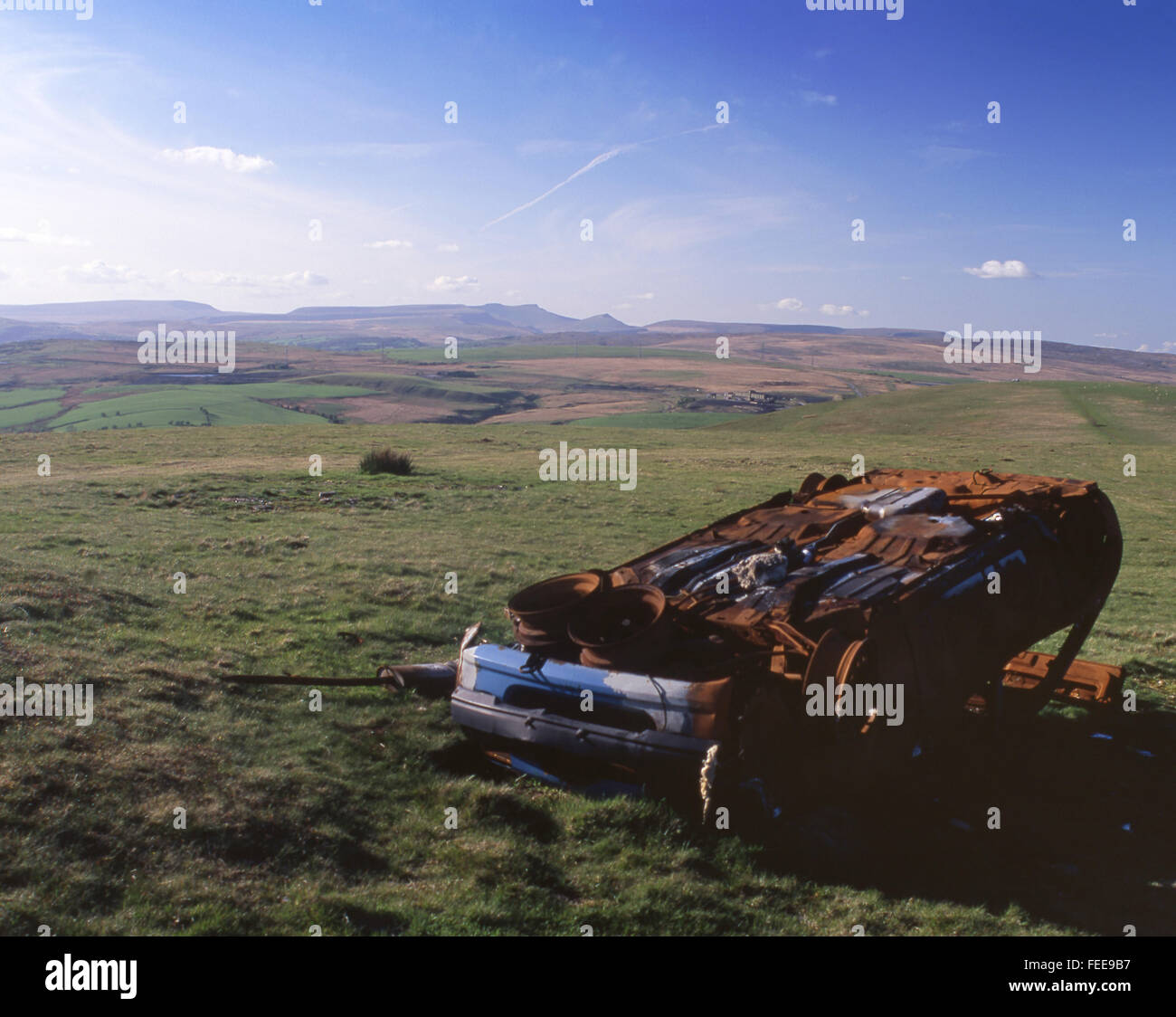 Abandoned burned burnt out car left at beauty spot on Gelligaer Common