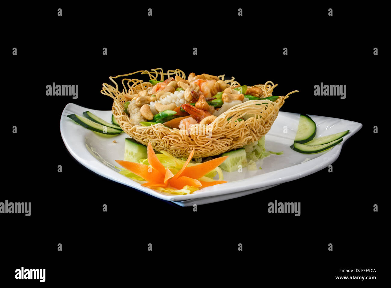 chicken in bird nest, traditional  chinese dish on black background Stock Photo