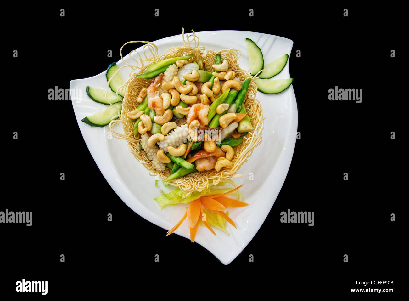 chicken in bird nest, traditional  chinese dish on black background Stock Photo