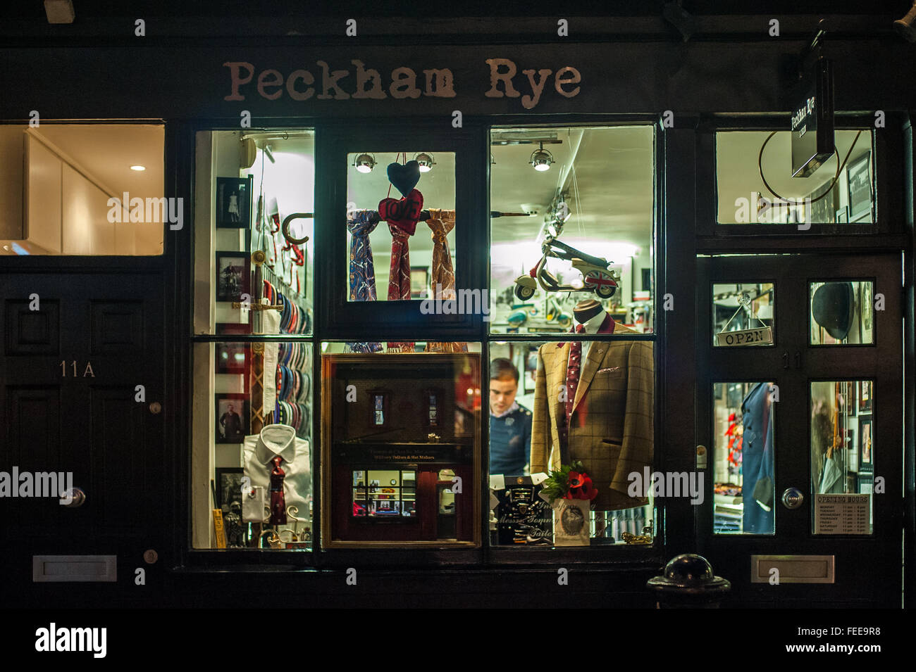 Outside a traditional suit and tie shop at night, Soho, London Stock Photo