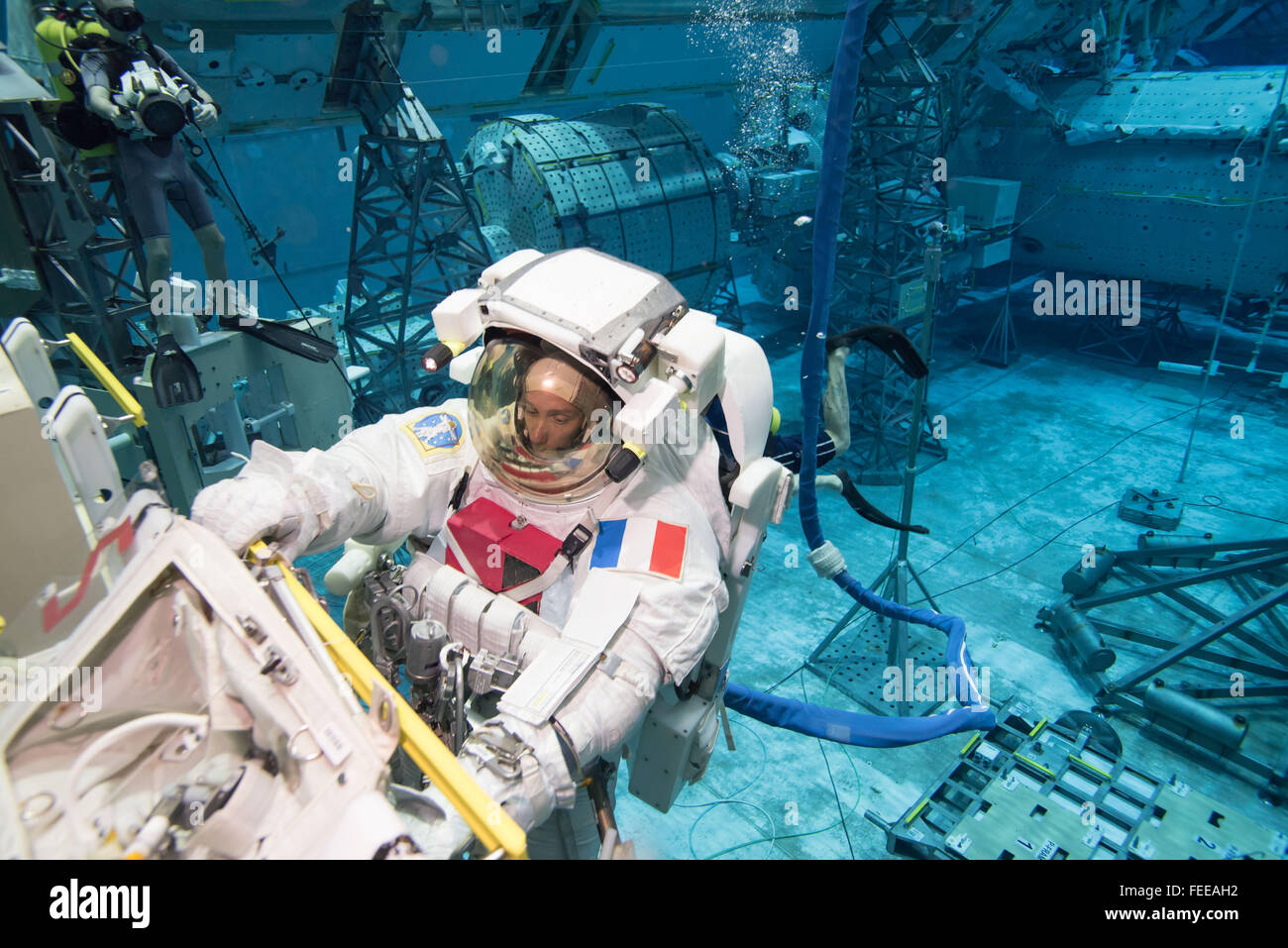 French ESA astronaut Thomas Pesquet during training with the EVA spacesuit in the Neutral Buoyancy Lab simulator at the Johnson Space Center January 12, 2016 in Houston, Texas. Stock Photo