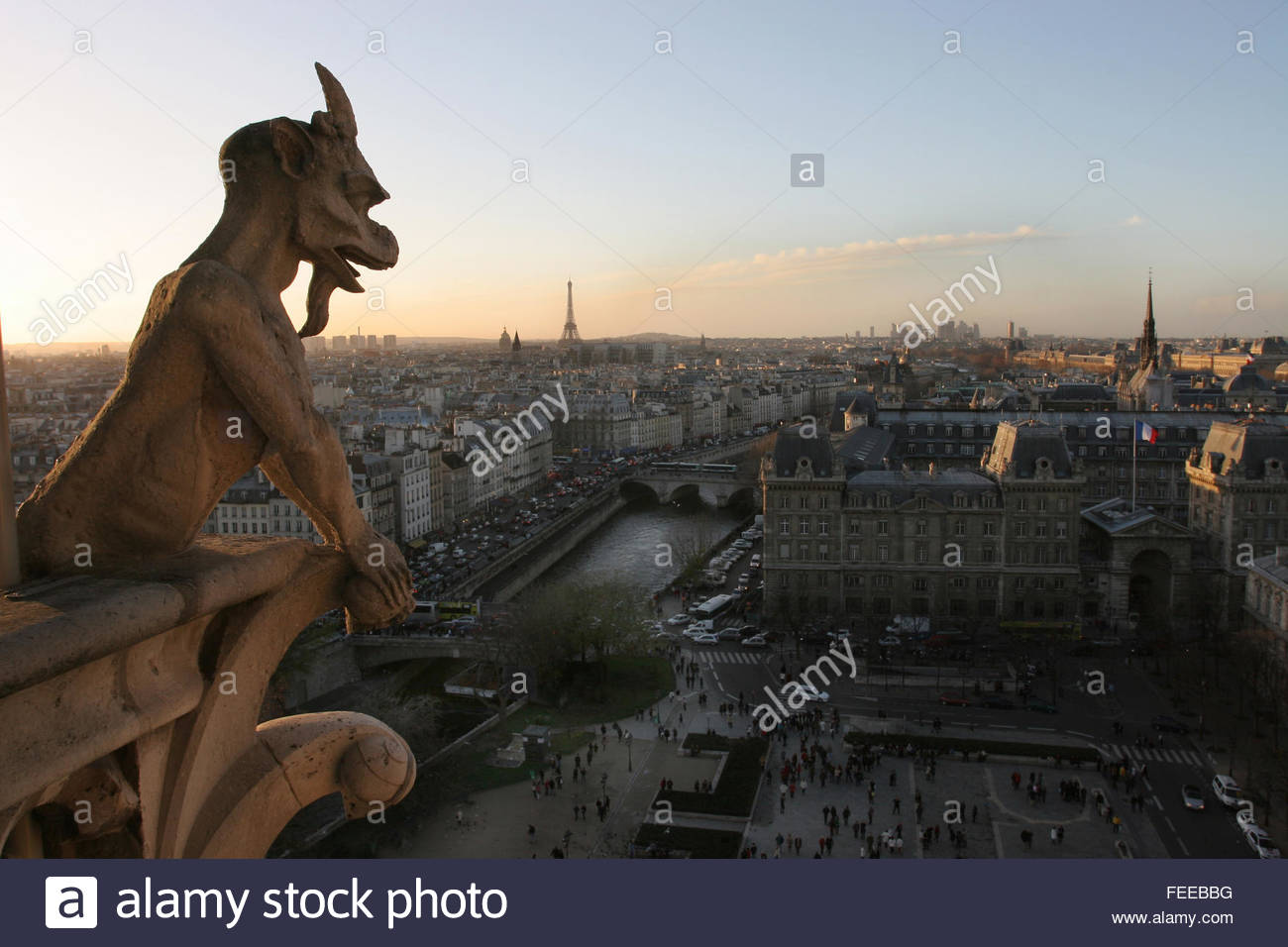 Notre-Dame de Paris, 1163, Notre Dame cathedral gargoyle, view of Seine and Eiffel tower at sunset, Paris, France © IndyFoto