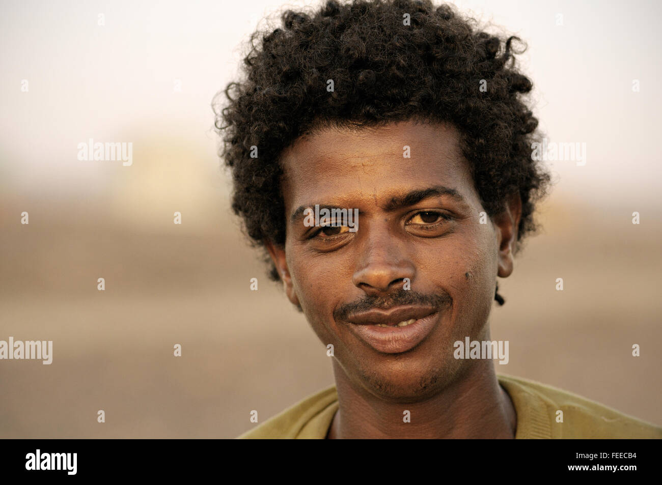 Young african man in the village of Ahmed Ela, Danakil depression, Afar Region, Ethiopia Stock Photo