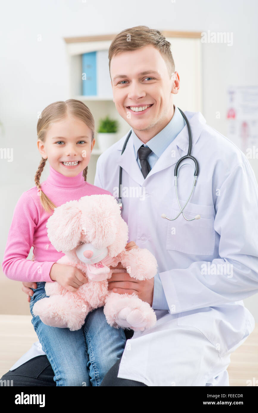 Professional pediatrician examining little girl Stock Photo Alamy