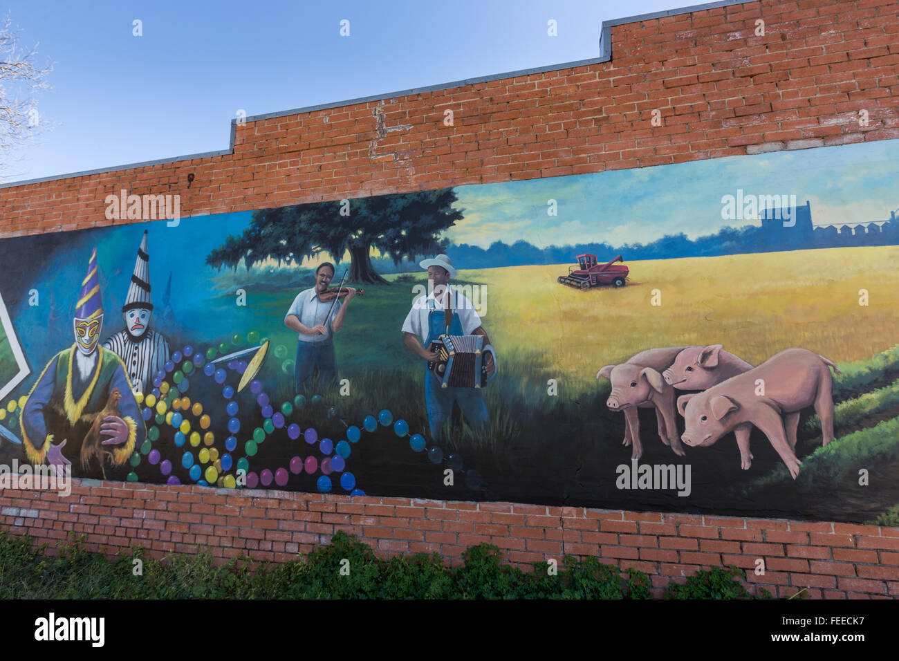 Mural painted along a building showing the Cajun culture in Basile
