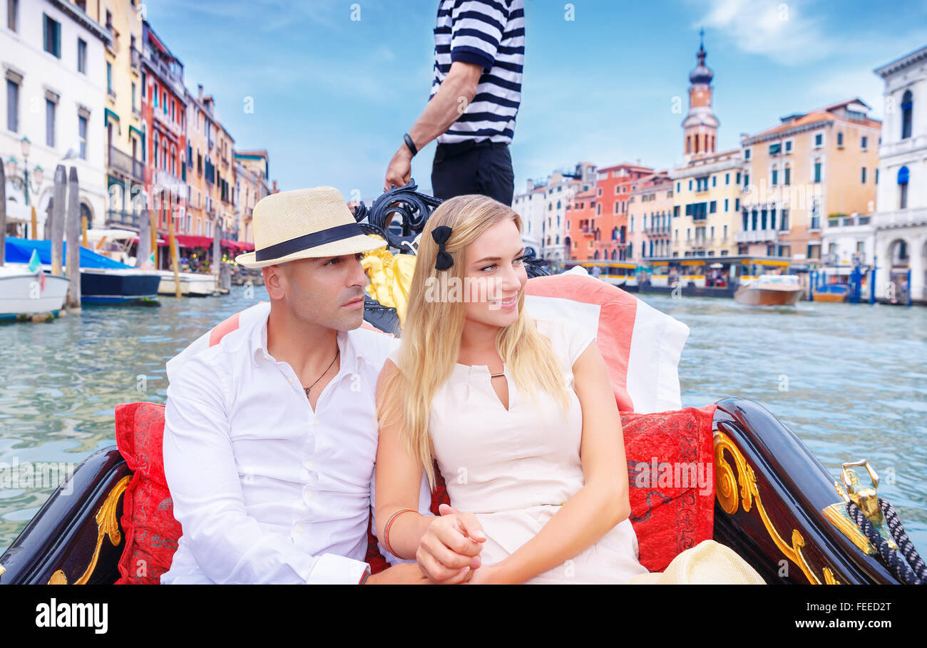 Young happy couple riding on a gondola on Grand Canal in stock photo young happy couple riding on a gondola on grand canal in venice with