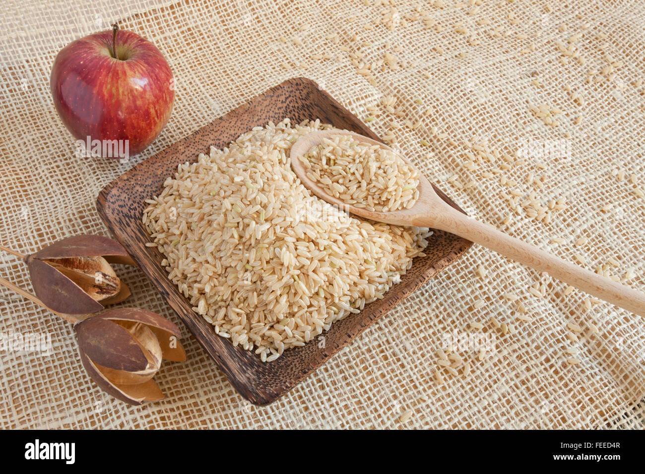Uncooked integral Ribe rice in a wooden cup Stock Photo - Alamy
