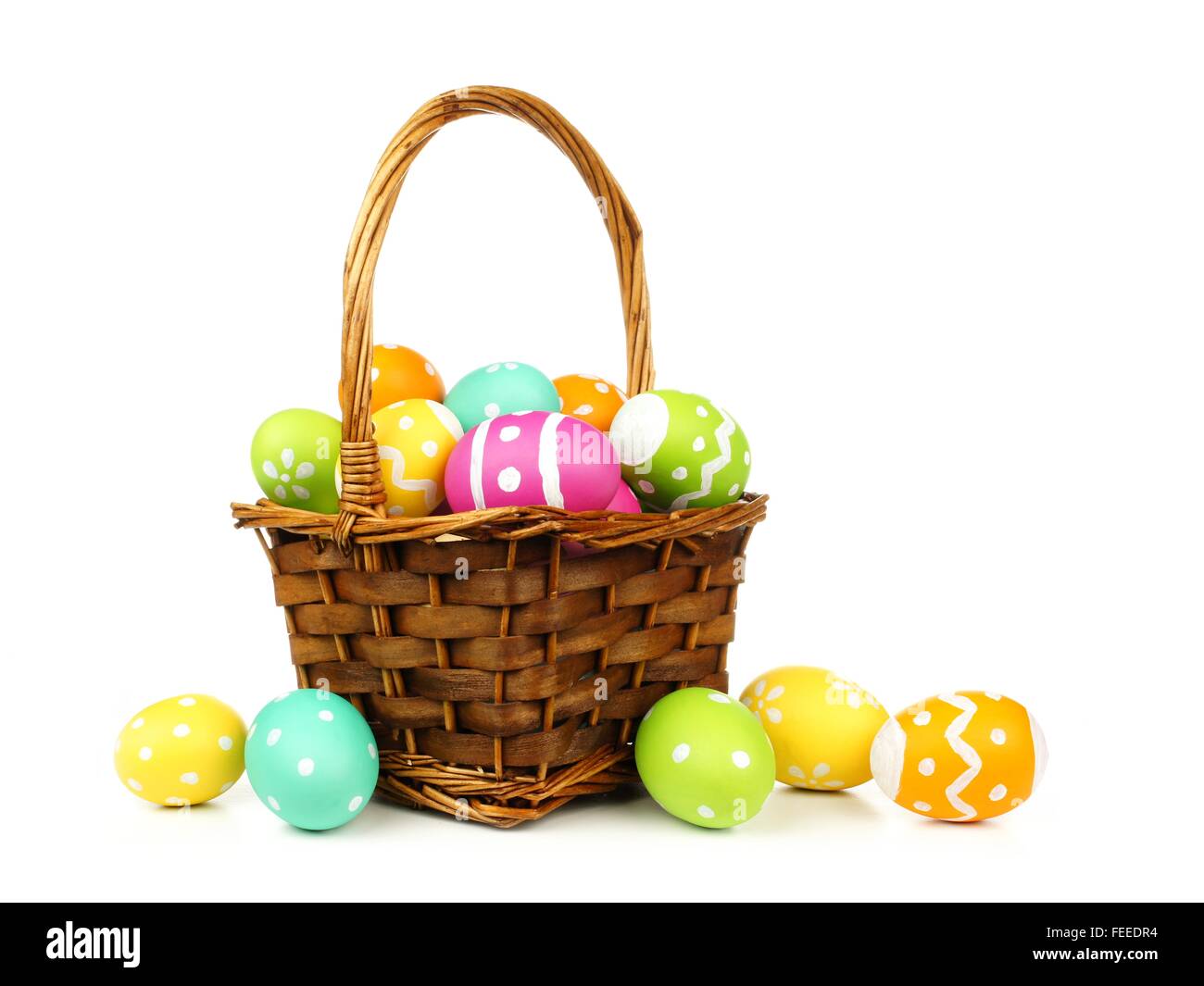 Easter basket filled with colorful eggs on a white background Stock ...