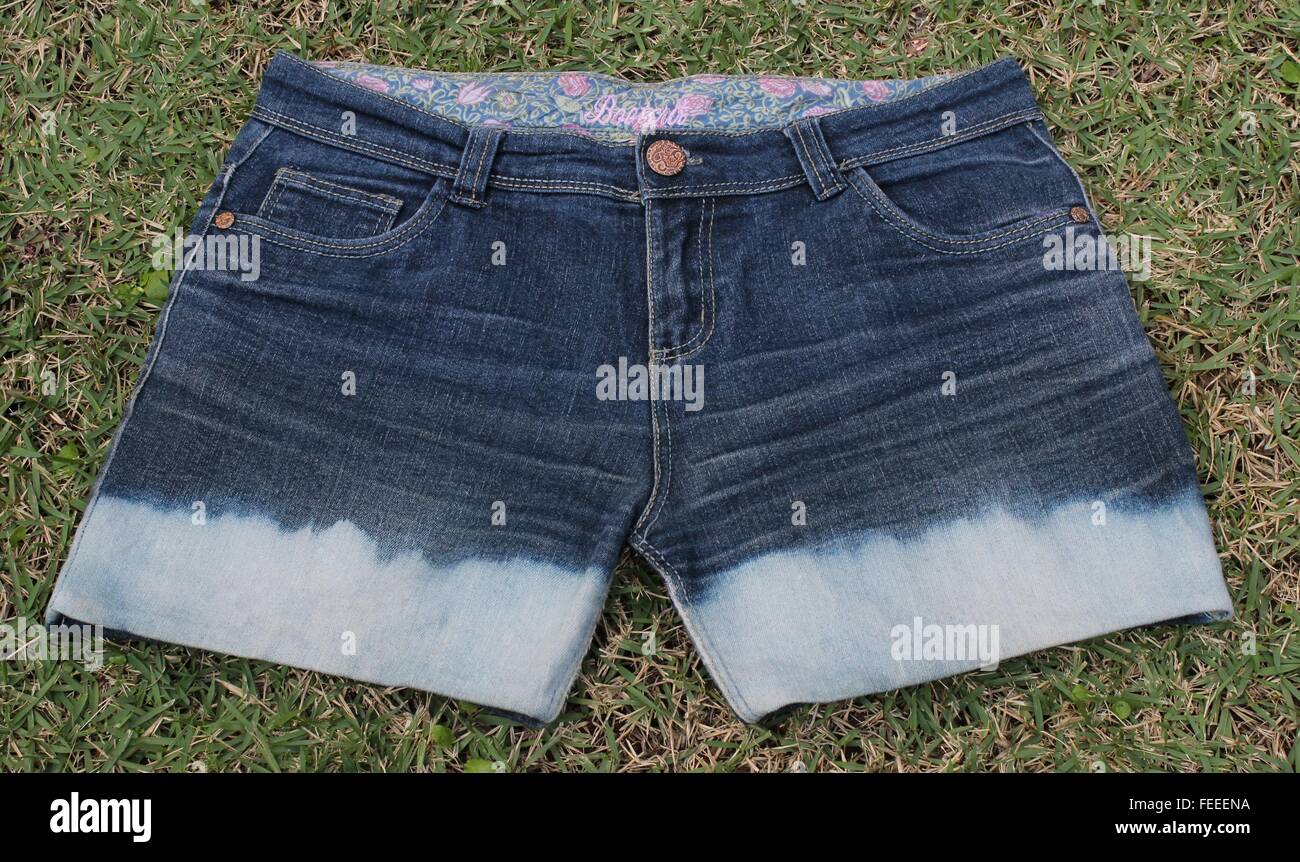 Short jeans after applying bleach, presented discoloration. Stock Photo