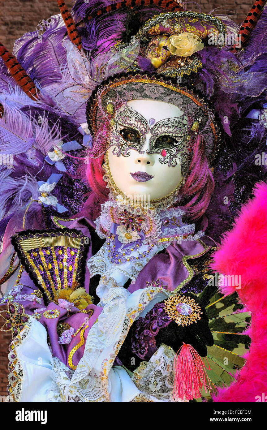 Masked participant on the Island of Burano during Carnival in Venice, Italy Stock Photo
