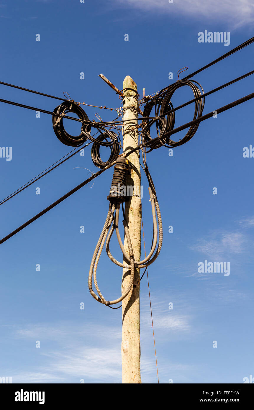 an old fashion pole with cables and wires, symbol of communication and internet Stock Photo