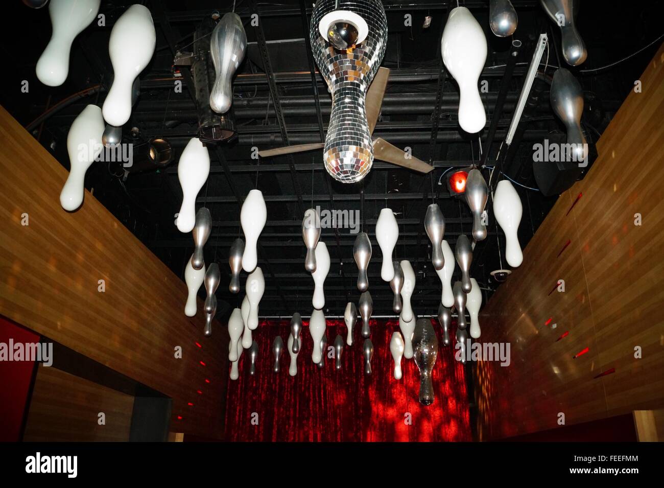 Bowling pins hanging from the ceiling at a bowling club in Manhattan. Stock Photo