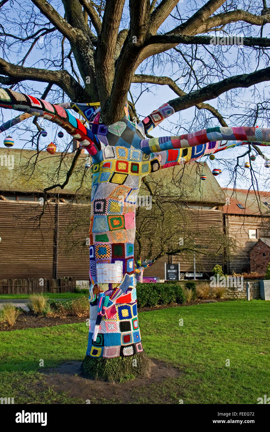 Knitted patterned squares on a deciduous tree in Bancroft Gardens in Stratford upon Avon. Stock Photo