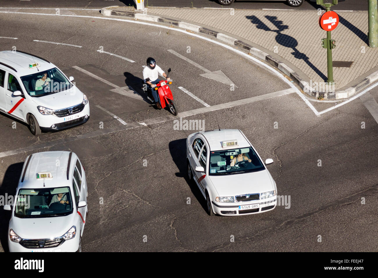 Spain,Europe,European,Spanish,Hispanic Latin Latino ethnic immigrant immigrants minority,Madrid,Chamberi,Plaza Alonzo Martinez,traffic,scooter scooter Stock Photo