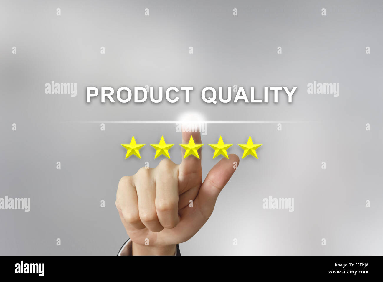 business hand clicking product quality with five stars on screen Stock Photo