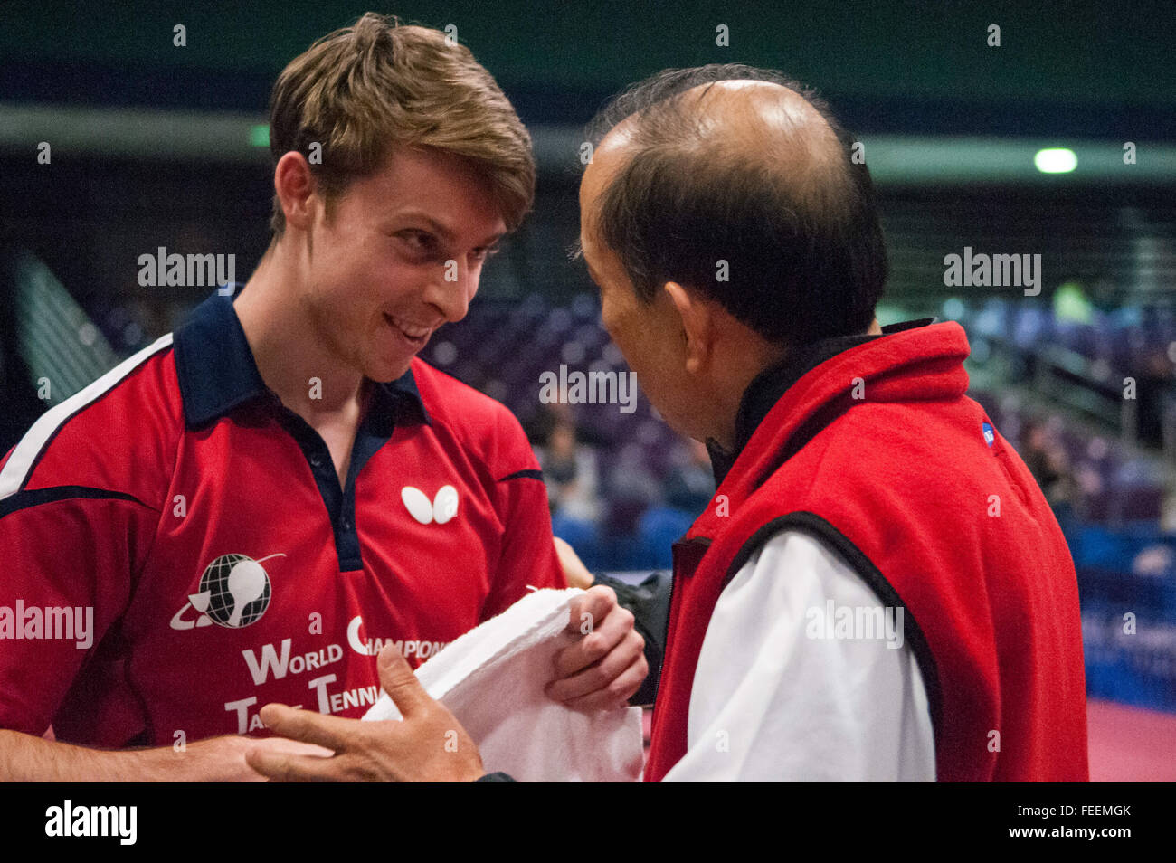Greensboro, North Carolina, US. 5th Feb, 2016. Feb. 5, 2016 - Greensboro, N.C., USA - MICHAEL LANDERS listens to his coach, LI ZHEN SHI, during a timeout in his men's quarterfinals match against Jack Wang on the second day of the 2016 U.S. Olympic Table Tennis Trials. Landers defeated Wang to advance to the semi-finals. The top three men and women from the trials move on to compete in April at the 2016 North America Olympic Qualification tournament in Ontario, Canada. The 2016 Summer Olympics will be held in Rio De Janeiro, Brazil, Aug. 5-21. © Timothy L. Hale/ZUMA Wire/Alamy Live News Stock Photo