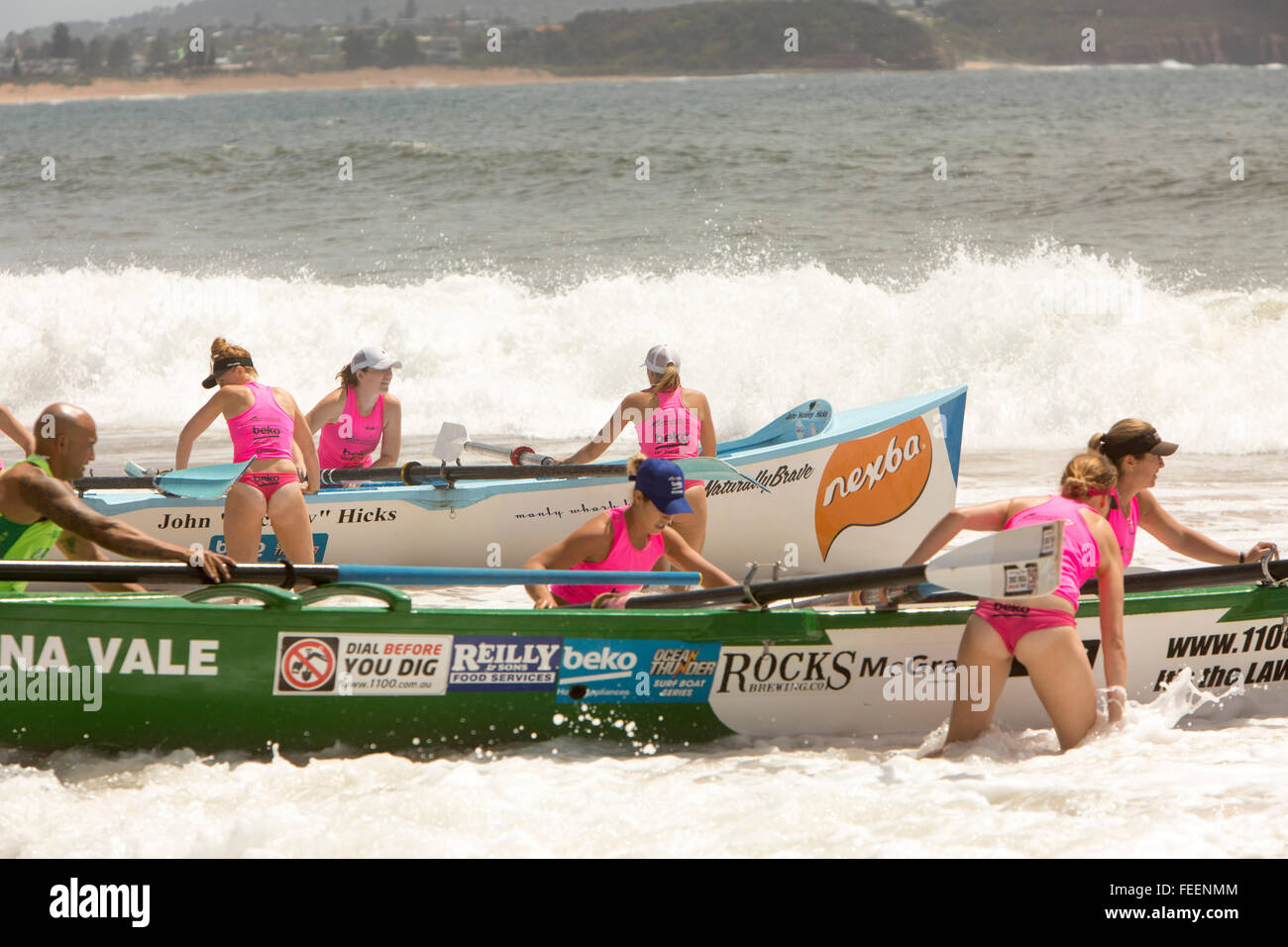Sydney, Australia. 6th February, 2016. Ocean Thunder surfboat racing carnival a televised Professional Surf boat racing event held on Collaroy Beach,Sydney, featuring elite mens and womens surf boat series. Credit:  model10/Alamy Live News. Pictured womens crew team prepare to launch their surfboat Stock Photo