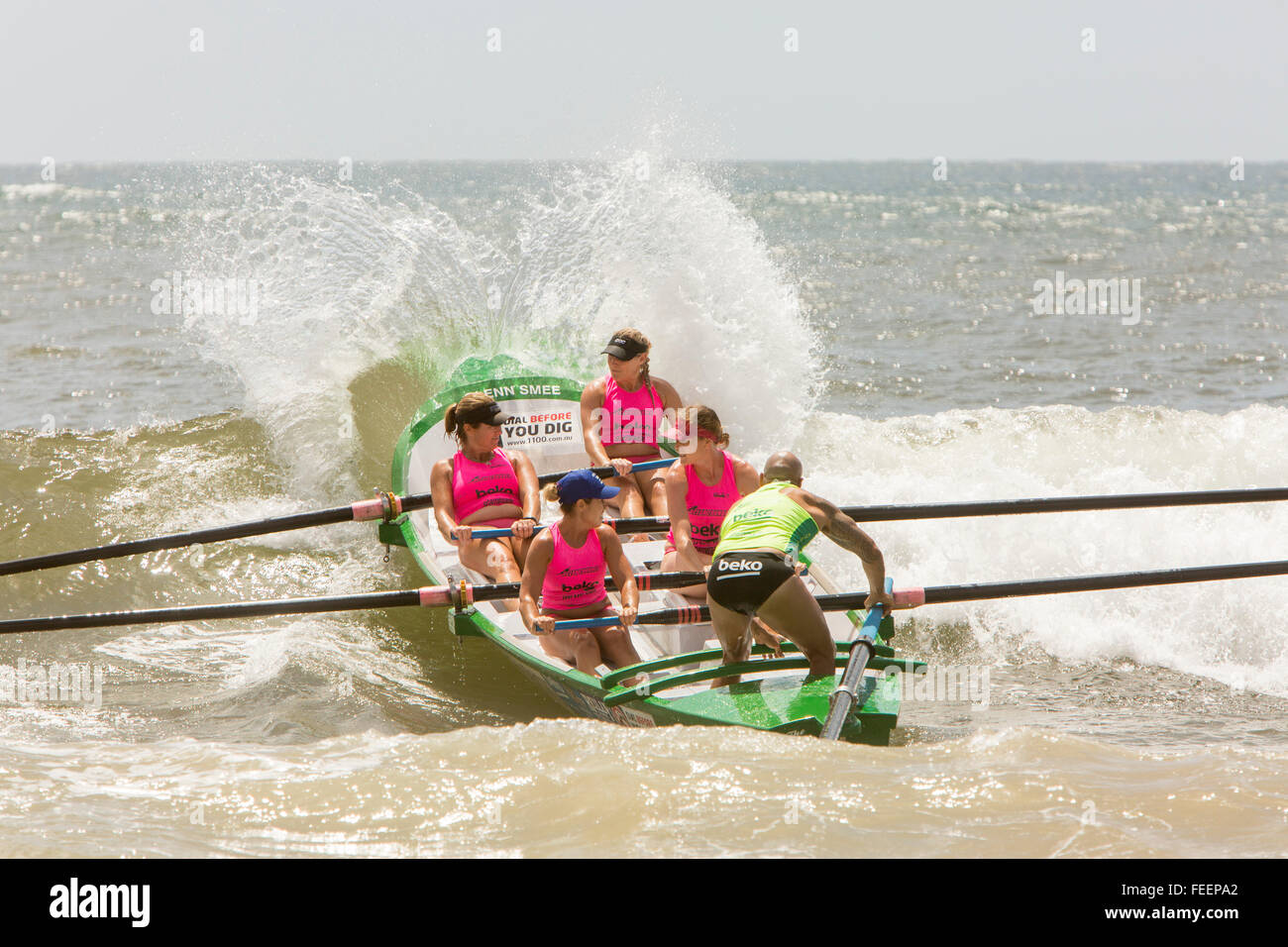 Sydney, Australia. 6th February, 2016. Ocean Thunder a televised Professional Surf boat racing event held on Collaroy Beach,Sydney, New South Wales featuring elite mens and womens surf boat series. Pictured womens female crew row their surfboat over incoming wave Stock Photo