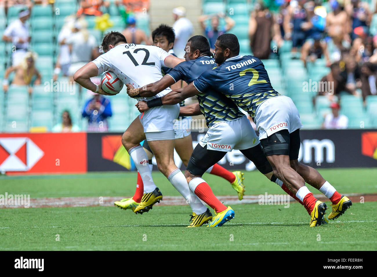 Sydney, Australia. 06th Feb, 2016. HSBC World Rugby Sevens Sydney day 1. England versus Japan. Englands Alex Gray trys to evade the Japanese defence led by Lote Tuqiri. England won the game 26-5. Credit:  Action Plus Sports/Alamy Live News Stock Photo