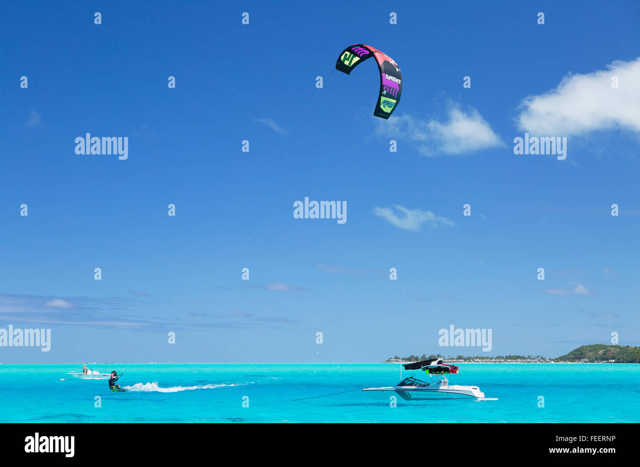 Man kitesurfing in lagoon, Bora Bora, Society Islands, French Polynesia