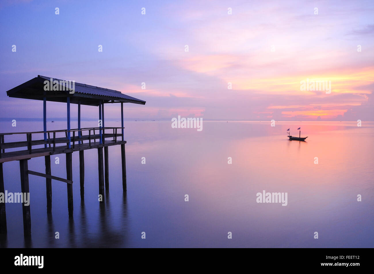Colourful sunrise at Kenjeran Beach, Surabaya, Indonesia. Stock Photo
