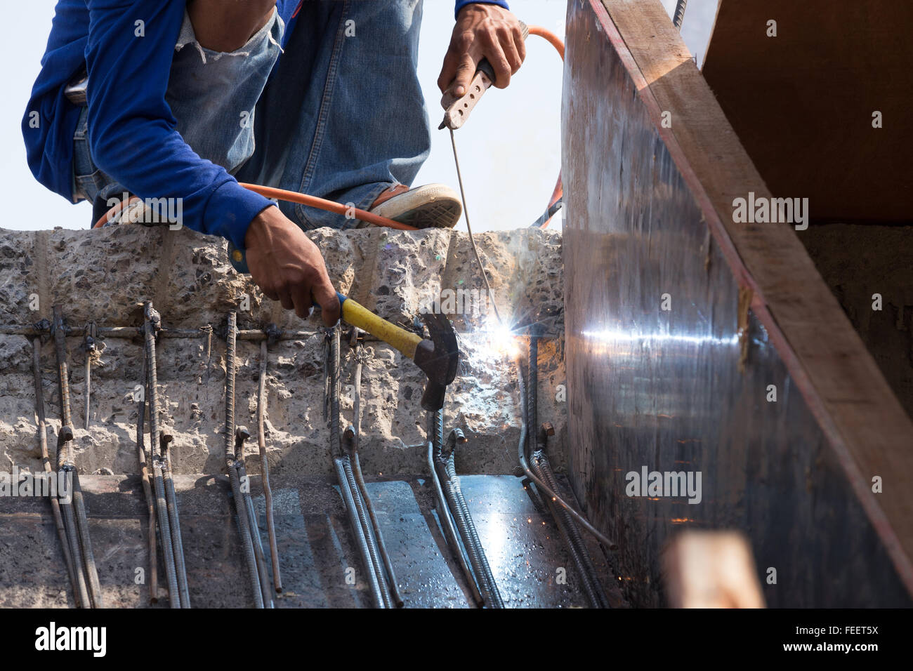 worker welding steel metal at construction site Stock Photo