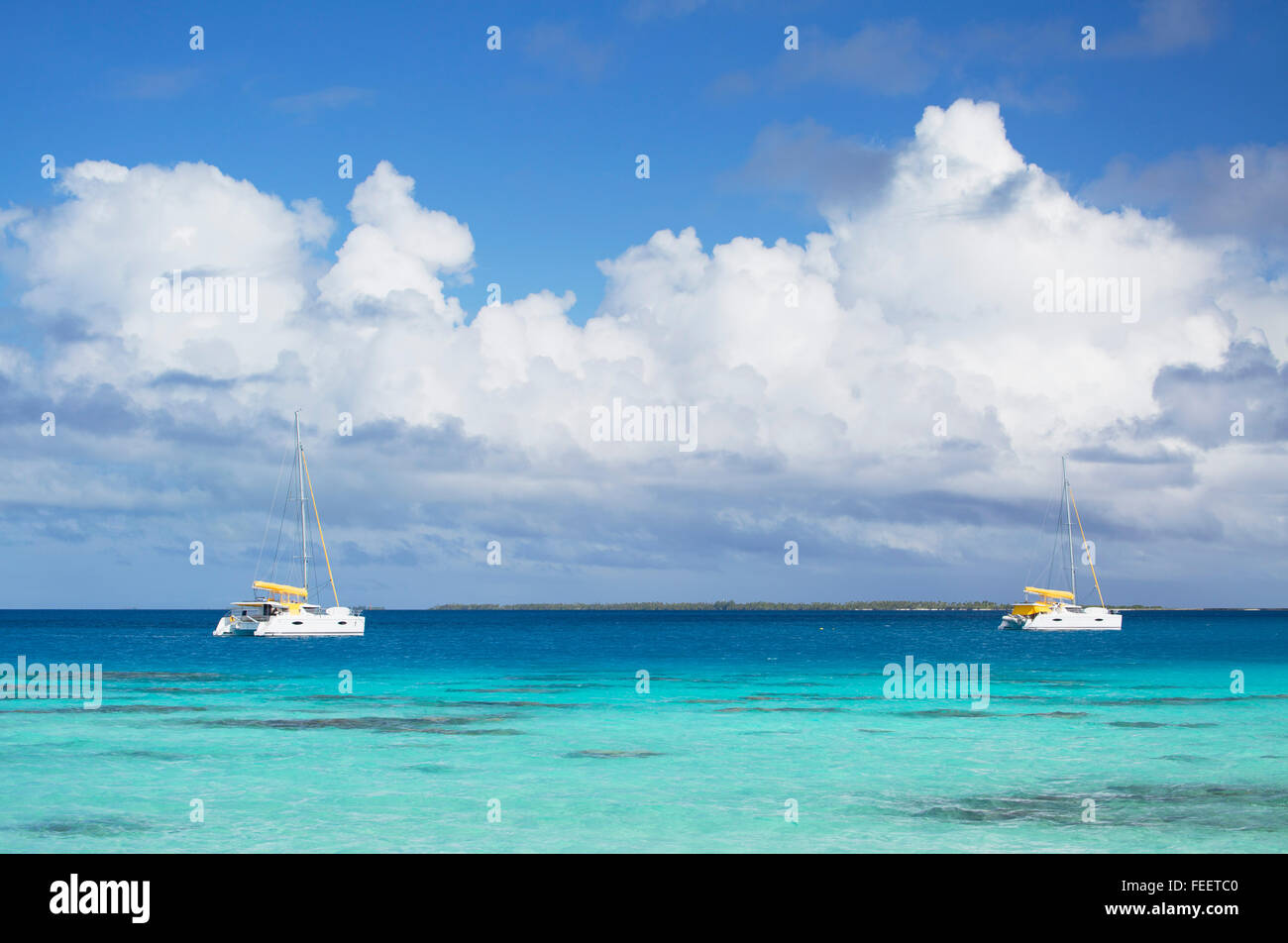 Yachts on lagoon, Fakarava, Tuamotu Islands, French Polynesia Stock Photo