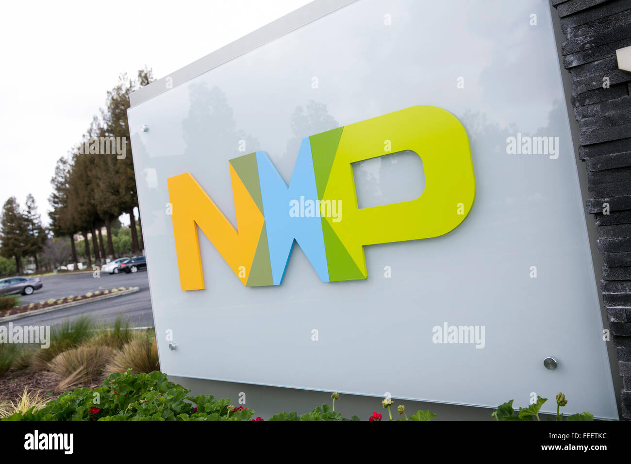A logo sign outside of a facility occupied by NXP Semiconductors in San ...