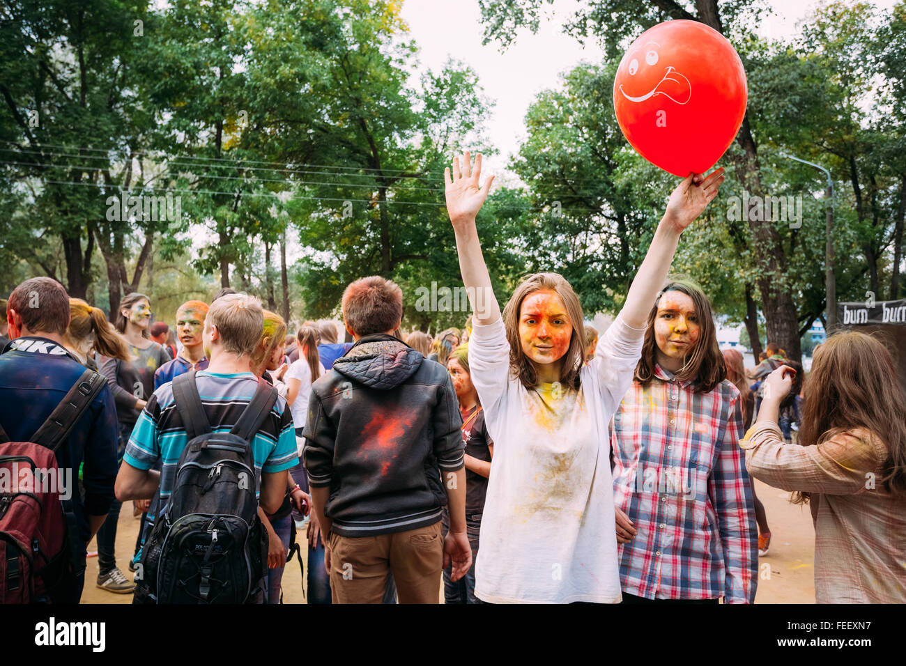 Gomel, Belarus - September 12, 2015: Young people having fun and dancing together at Holi color festival in park Stock Photo