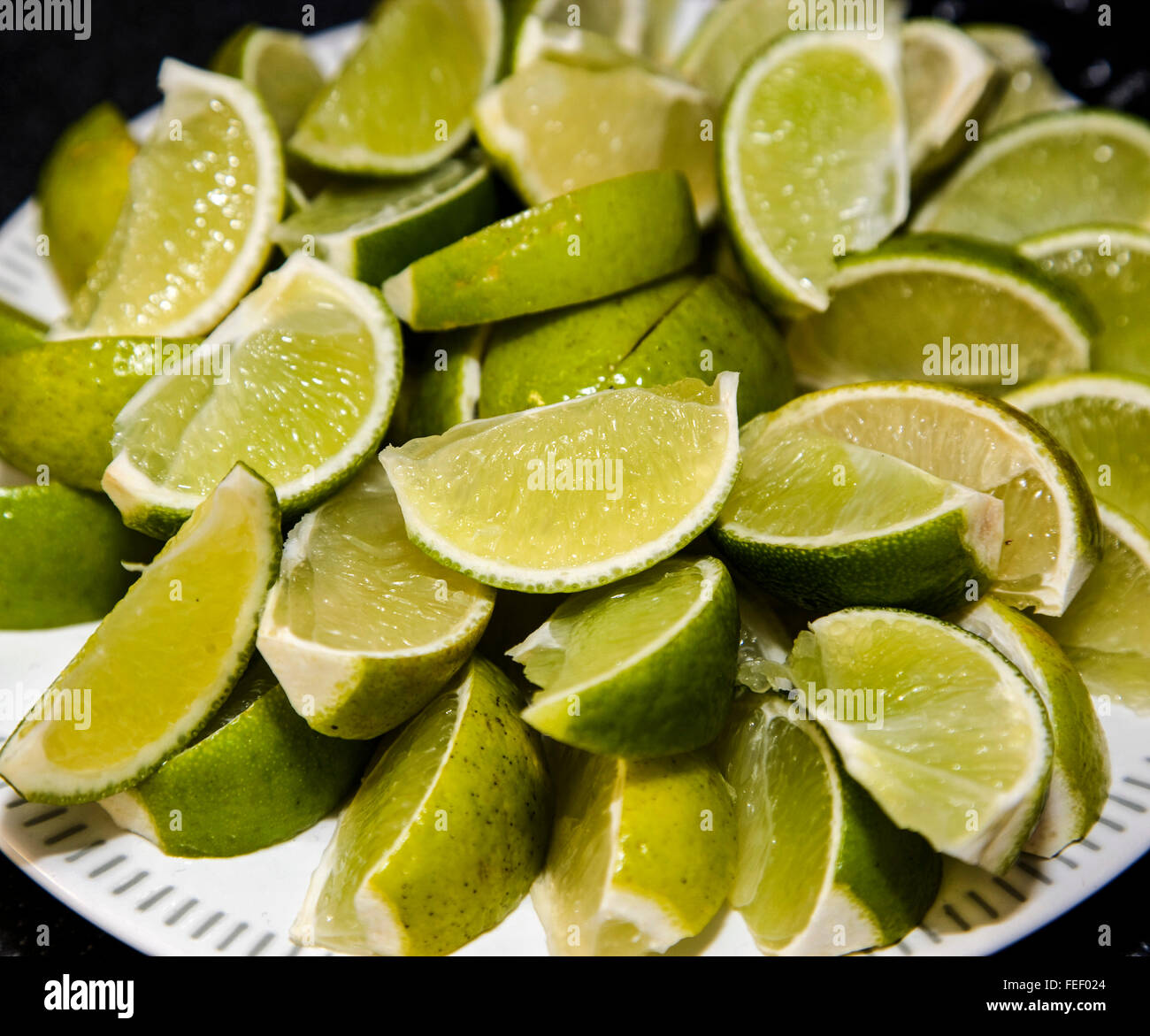 Sliced limes wedges on a bar Stock Photo Alamy