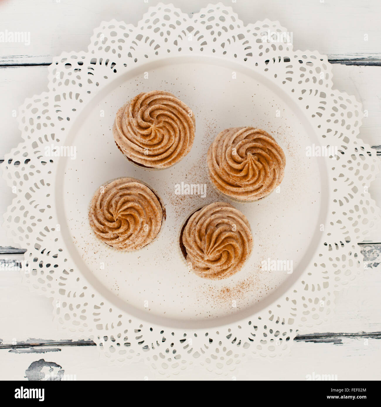 four cupcakes with mocca tooping Stock Photo