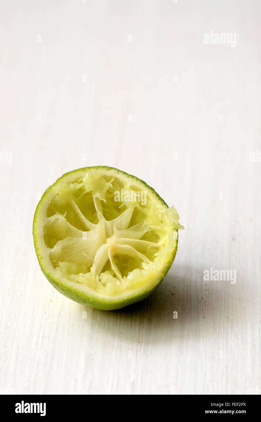 Squeezed lime white background hi res stock photography and images