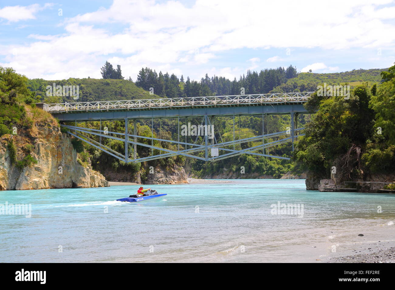 A man operating his jet boat on the Rakaia River near Windwhistle in Canterbury, New Zealand. Stock Photo