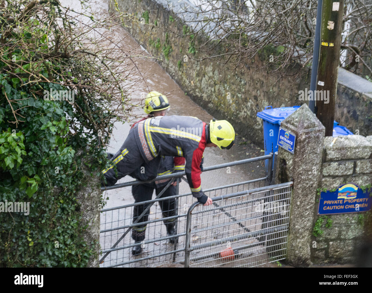 Mousehole, Cornwall, UK. 6th February 2016. UK Weather. Residents of the village of Mousehole in Cornwall awoke to heavy rain and a torrent of water, which is threatening to flood properties and damage parked cars. Credit:  Simon Maycock/Alamy Live News Stock Photo
