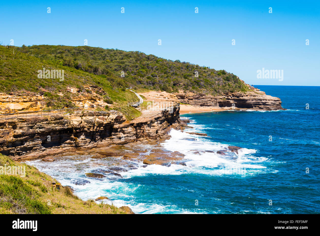 Australian rock formation with ocean in background, sandstone texture